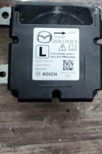 D65K57K30B HỘP ĐIỀU KHIỂN TÚI KHÍ MAZDA 2