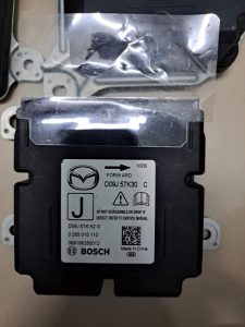 D09J57K30C HỘP ĐIỀU KHIỂN TÚI KHÍ MAZDA 2